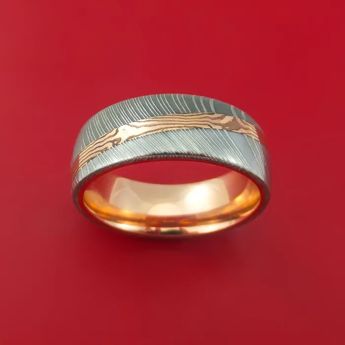 Damascus Steel Ring with Diagonal Rose Gold Mokume Shakudo Inlay and Gold Sleeve Custom Made Lashbrook Rings Damascus Steel Ring with Diagonal Rose Gold Mokume Shakudo Inlay and Gold Sleeve Custom Made Lashbrook Rings