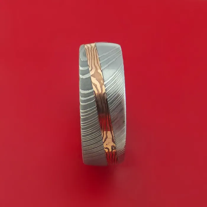 Damascus Steel Ring with Diagonal Rose Gold Mokume Shakudo Inlay and Gold Sleeve Custom Made Lashbrook Rings Damascus Steel Ring with Diagonal Rose Gold Mokume Shakudo Inlay and Gold Sleeve Custom Made Lashbrook Rings