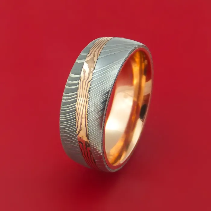 Damascus Steel Ring with Diagonal Rose Gold Mokume Shakudo Inlay and Gold Sleeve Custom Made Lashbrook Rings Damascus Steel Ring with Diagonal Rose Gold Mokume Shakudo Inlay and Gold Sleeve Custom Made Lashbrook Rings