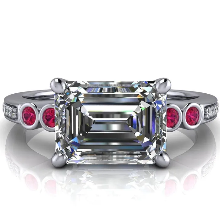 Fire Brilliance Rings Philippa Emerald Moissanite 4 Ruby Sides 4 Prong Under Bezel Multi Stone Engagement Ring